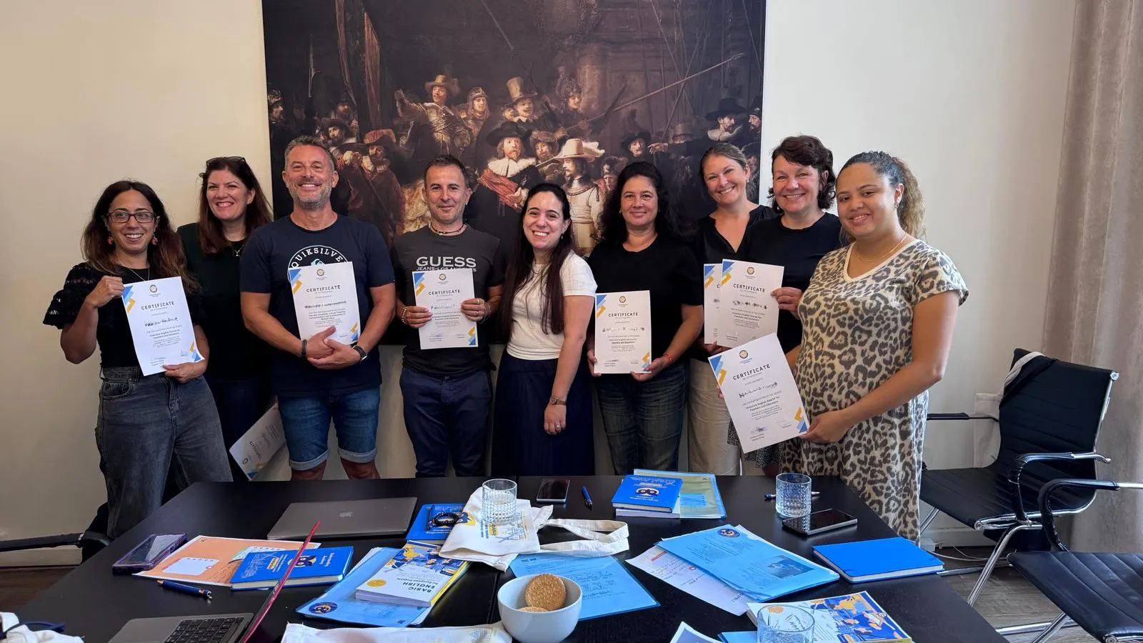 International educators holding Certificates of Attendance after completing an English course in Amsterdam