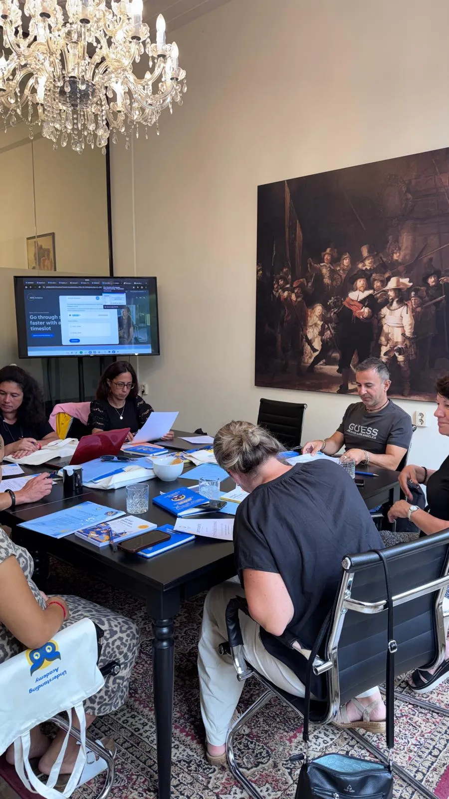 International educators working with English course materials in an Amsterdam classroom