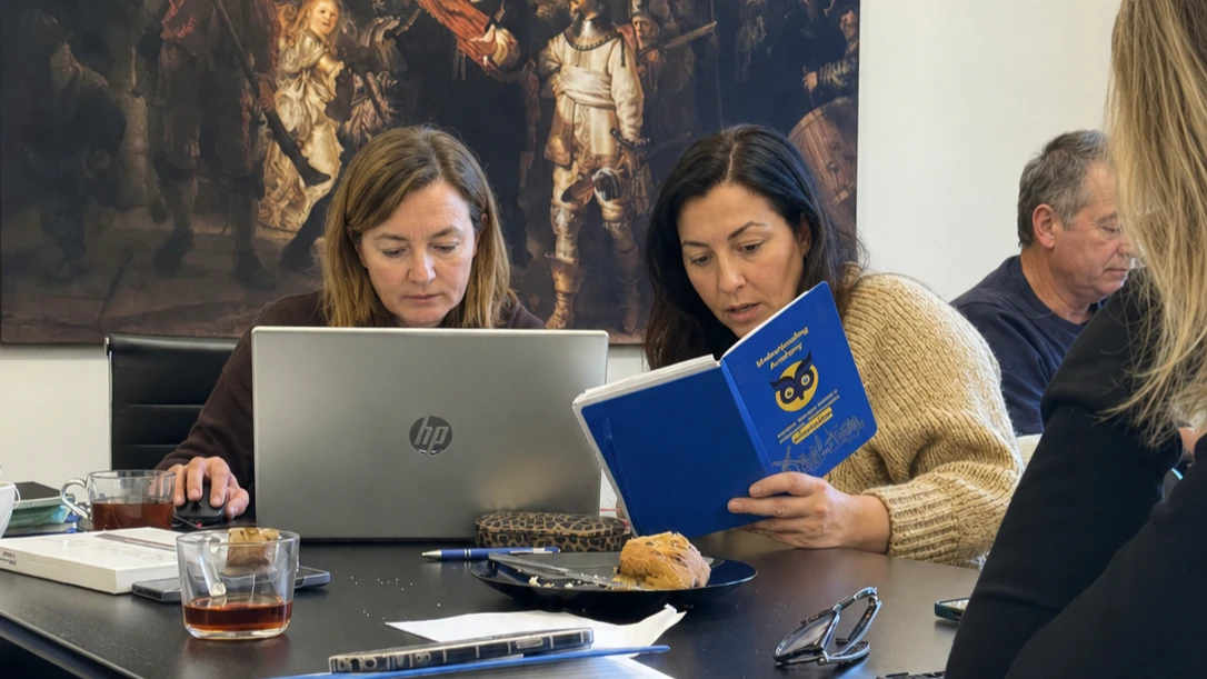 Education professional concentrating on a laptop during a digital-safety activity