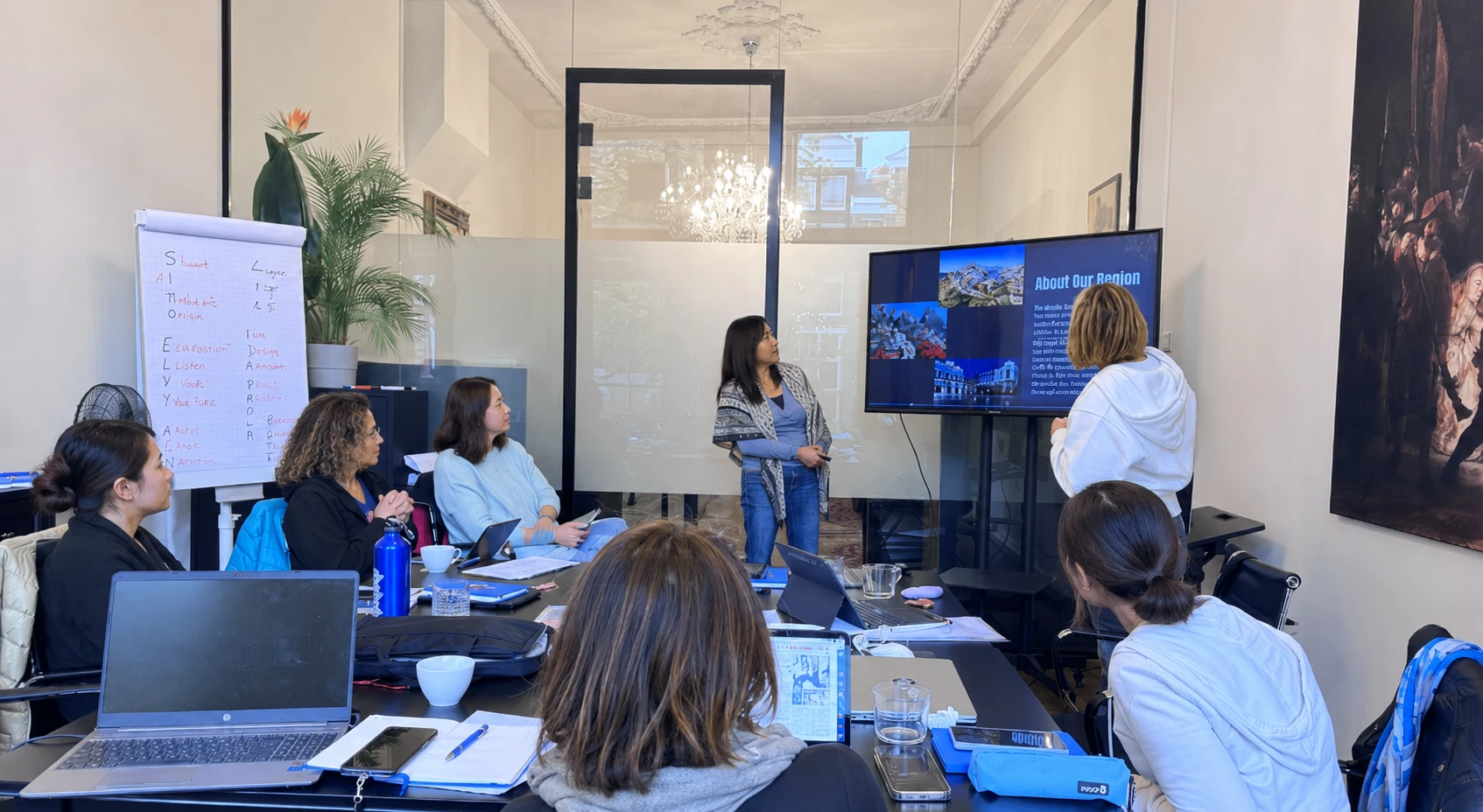 Education professional presenting information to an international learning group
